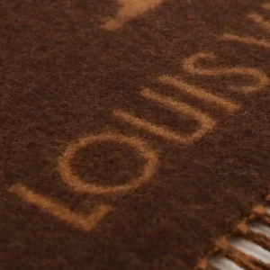 Louis Vuitton Printed Cashmere Fringe Scarf featuring the brand name in a warm brown color, highlighting luxury and quality for winter accessories.