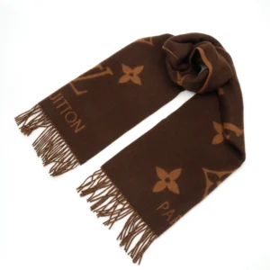 Louis Vuitton Printed Cashmere Fringe Scarf featuring iconic monogram design, luxurious brown color, and fringed edges, ideal for stylish winter accessory.