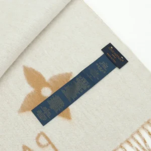 Louis Vuitton Printed Cashmere Fringe Scarf featuring a full print pattern, care label, and luxurious fringe detailing.