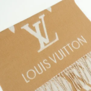 Louis Vuitton Printed Cashmere Fringe Scarf featuring the iconic LV logo and fringe detailing, showcasing high-quality craftsmanship in a luxury accessory.