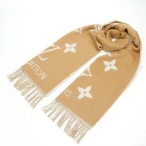 Louis Vuitton Printed Cashmere Fringe Scarf in beige with white logo and floral patterns, showcasing high-end fashion design and luxurious texture.