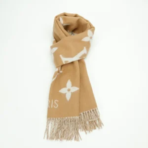 Louis Vuitton Printed Cashmere Fringe Scarf in beige with white floral pattern and fringed ends, showcasing high-end fashion accessory quality and design.