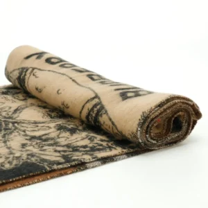 Balenciaga blanket beige black wool fabric with graphic print rolled up showcasing texture