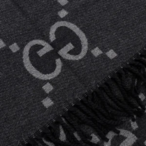 Gucci Big GG Double-Sided Jacquard Long Scarf with dark gray pattern and fringed edges, showcasing luxury designer branding.