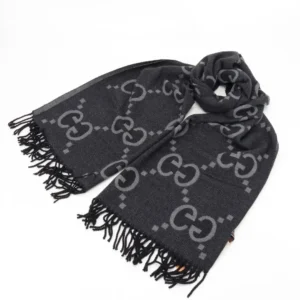 Gucci Big GG Double-Sided Jacquard Long Scarf in black with gray GG logo pattern and fringed edges, featured in luxury accessories collection.