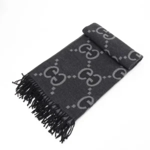 Gucci Big GG Double-Sided Jacquard Long Scarf in black with grey logo pattern and fringed edges, showcasing luxury designer accessory for fashion enthusiasts.