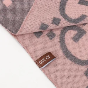 Gucci Big GG Double-Sided Jacquard Long Scarf detail with logo tag, showcasing luxury fabric and design elements.