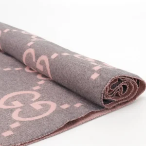 Gucci Big GG Double-Sided Jacquard Long Scarf in soft pink and gray, showcasing the iconic GG logo and elegant design, ideal for luxury fashion.