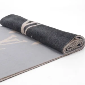 Louis Vuitton gradient cashmere fringe scarf rolled, showcasing luxury design and fabric quality.