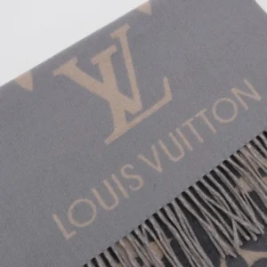 Louis Vuitton gradient cashmere fringe scarf featuring the iconic LV logo and fringed edges, showcasing luxury fashion accessory details.