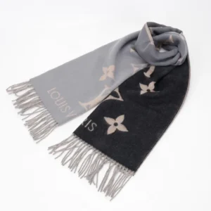 Louis Vuitton gradient cashmere fringe scarf featuring a blend of gray and black colors with iconic floral patterns and fringe detailing, highlighting luxury fashion accessory.