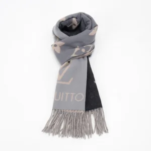 Louis Vuitton gradient cashmere fringe scarf featuring a stylish design with a blend of gray and black colors, showcasing the brand's logo and floral patterns, perfect for accessorizing.