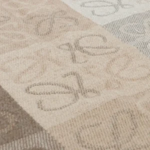 Loewe Checkerboard Logo Wool Scarf featuring a luxurious knitted pattern in neutral tones, highlighting the brand's iconic logo design.