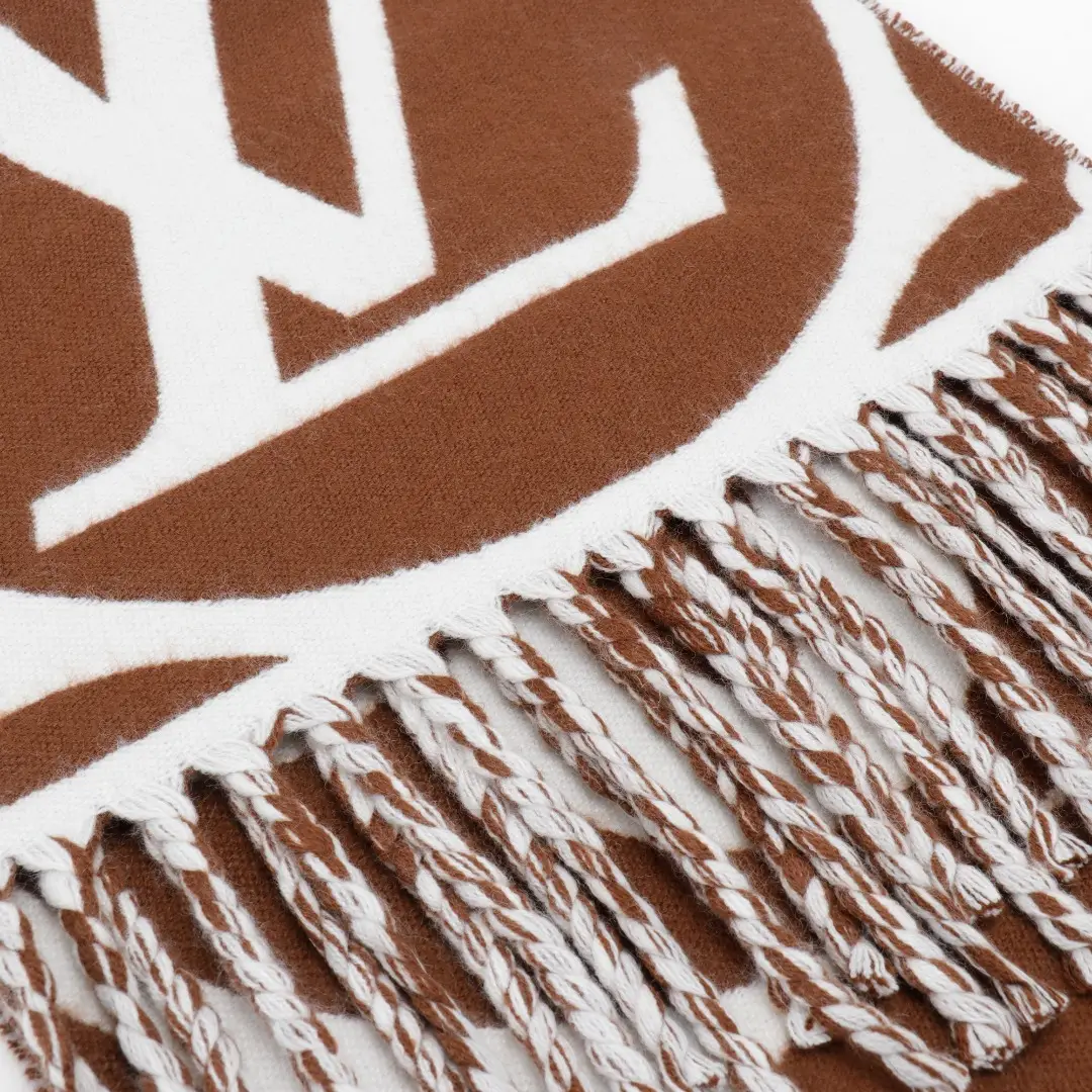 Louis Vuitton Mahjong Double Sided Wool Cashmere Tassel Scarf featuring prominent logo design and fringed edges.