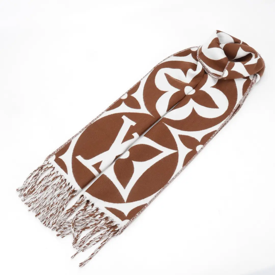 Louis Vuitton Mahjong Double Sided Wool Cashmere Tassel Scarf featuring a brown and white pattern with iconic logo design and fringed edges.