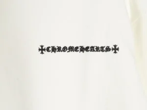 Chrome Hearts logo featuring gothic lettering and decorative cross elements on a white hoodie, representing premium replica fashion.