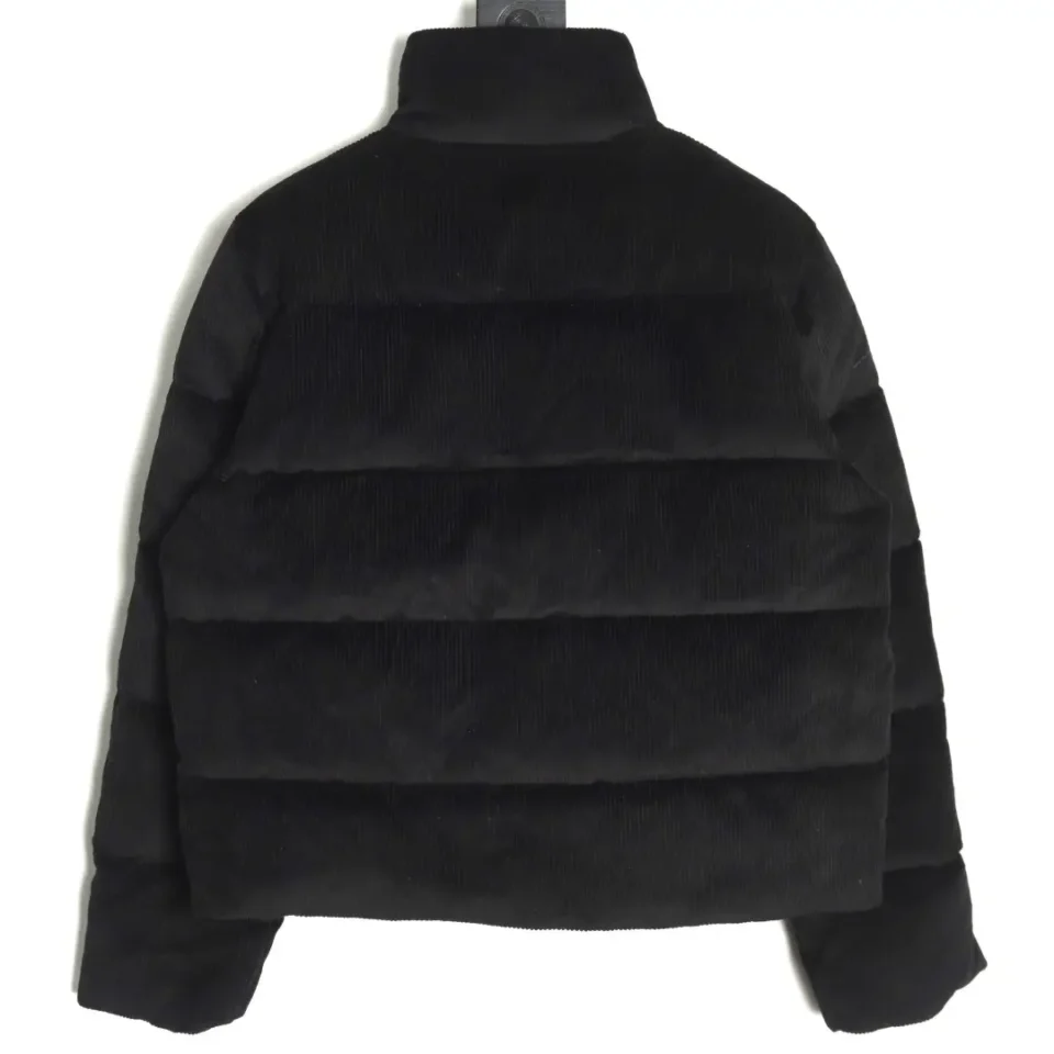 No brand or model information visible for this black corduroy puffer jacket with quilted design material
