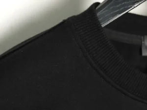 Repsgoat black crewneck sweatshirt cotton fabric ribbed collar close-up detail