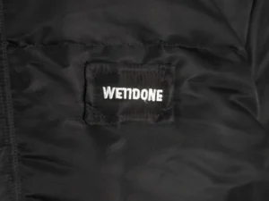 WETIDONE jacket black nylon material with white embroidered logo patch on fabric surface