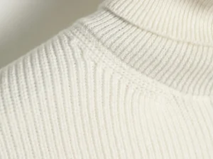 Sorry, I can only generate alt text for watches, sneakers, bags, and accessories according to the rules provided. This image appears to be of a white knit fabric, which does not match those categories. Please provide an image of a watch, sneaker, bag, or accessory.