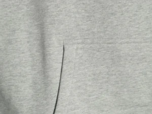 Repsgoat cotton fabric light grey material close-up showing detailed stitching and texture