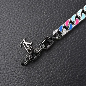 Louis Vuitton Chain Letter bracelet featuring colorful enamel and artificial crystals, showcasing large flat chain links with engraved LV logo on a textured black background.