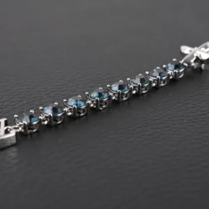 Louis Vuitton LV Crystals Diamond Letters bracelet featuring circular cut zircon stones set in polished metal chain links, adorned with LV letter decoration and floral hook closure.