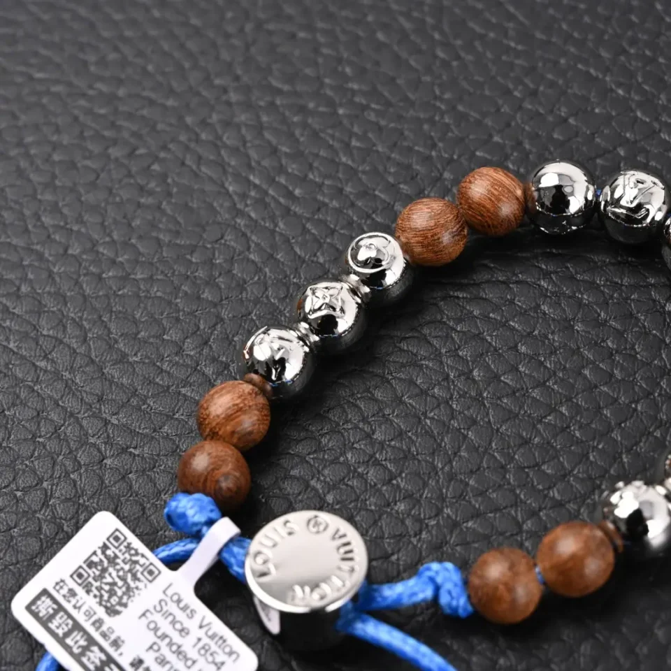 Louis Vuitton beaded bracelet brown wood and polished metal beads with blue cord accessory