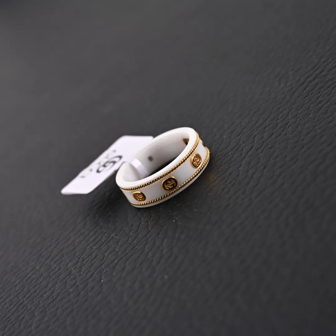 Gucci ring white enamel gold-tone metal logo detailing adjustable band accessory