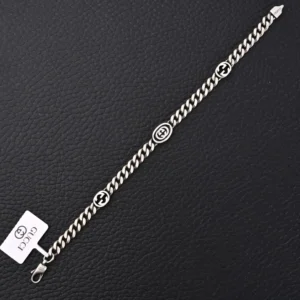Gucci chain bracelet silver tone metal with double G logo accents and lobster clasp closure