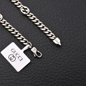 Gucci chain necklace silver color metal curb link chain with GG logo accents and lobster clasp closure