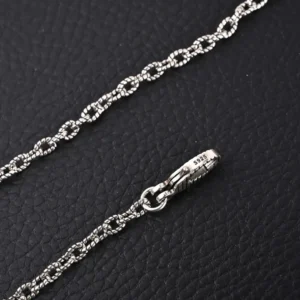 Gucci GUC 3D Double G Pure Silver Pendant Necklace chain detail on black background.