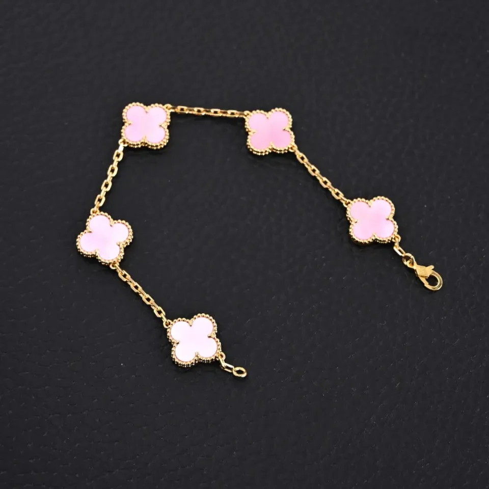 Van Cleef & Arpels Alhambra bracelet pink mother-of-pearl floral motifs yellow gold chain accessory