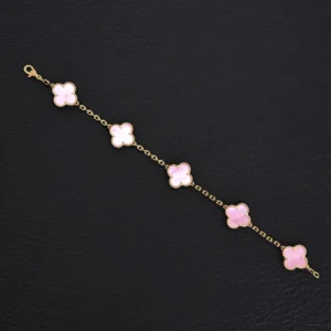 Van Cleef Arpels Classic Clover Bracelet in Sakura Pink, featuring four clover motifs, gold chain, and adjustable length, displayed on a black background.