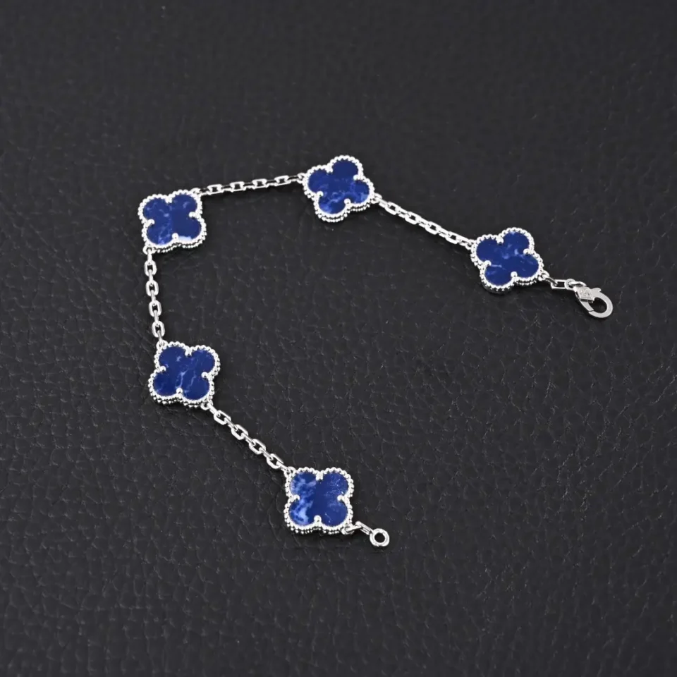 Van Cleef & Arpels Alhambra bracelet blue lapis lazuli clover motifs white gold chain accessory