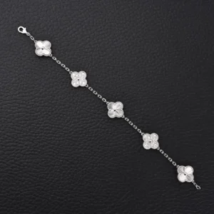 Van Cleef Arpels laser silver diamond clover bracelet featuring five flower motifs on a delicate chain, showcasing intricate craftsmanship and high-end design.