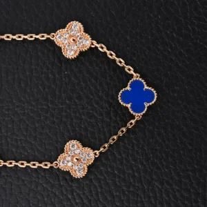 Van Cleef & Arpels replica bracelet featuring blue fritillaria, four leaf clover, and five flower designs, crafted in high-end 925 silver with 18K gold electroplating.