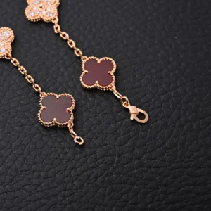 Van Cleef & Arpels Alhambra bracelet brown onyx rose gold chain with diamond clover charms