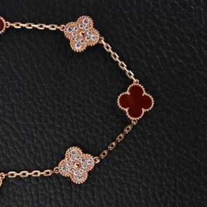 Van Cleef & Arpels Alhambra bracelet rose gold mother-of-pearl and diamond floral motifs luxury accessory
