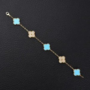 Van Cleef & Arpels Alhambra bracelet turquoise and diamond motifs yellow gold chain accessory
