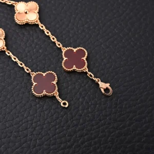 Van Cleef & Arpels Alhambra bracelet rose gold red agate clover charm accessory