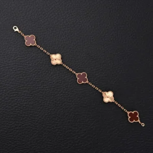 Van Cleef & Arpels Alhambra bracelet brown agate and rose gold floral charms lace edge detailing
