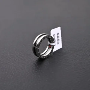 Bvlgari B.zero1 ring silver stainless steel black resin band with engraved logo design