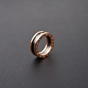 Bvlgari ring black ceramic and rose gold band with engraved logo luxury accessory