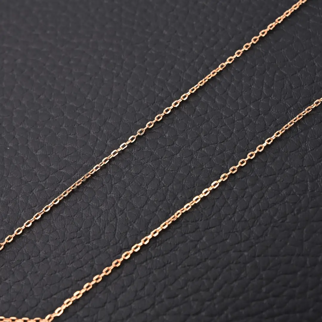 BVLGARI Diva fan-shaped necklace chain featuring delicate links on a textured black background.