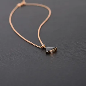 Louis Vuitton necklace black pendant rose gold chain delicate jewelry accessory