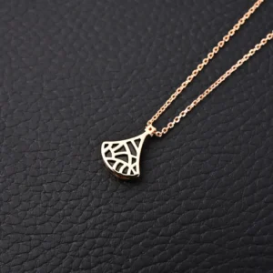 Tiffany & Co. pendant necklace rose gold metal geometric cutout design delicate chain accessory