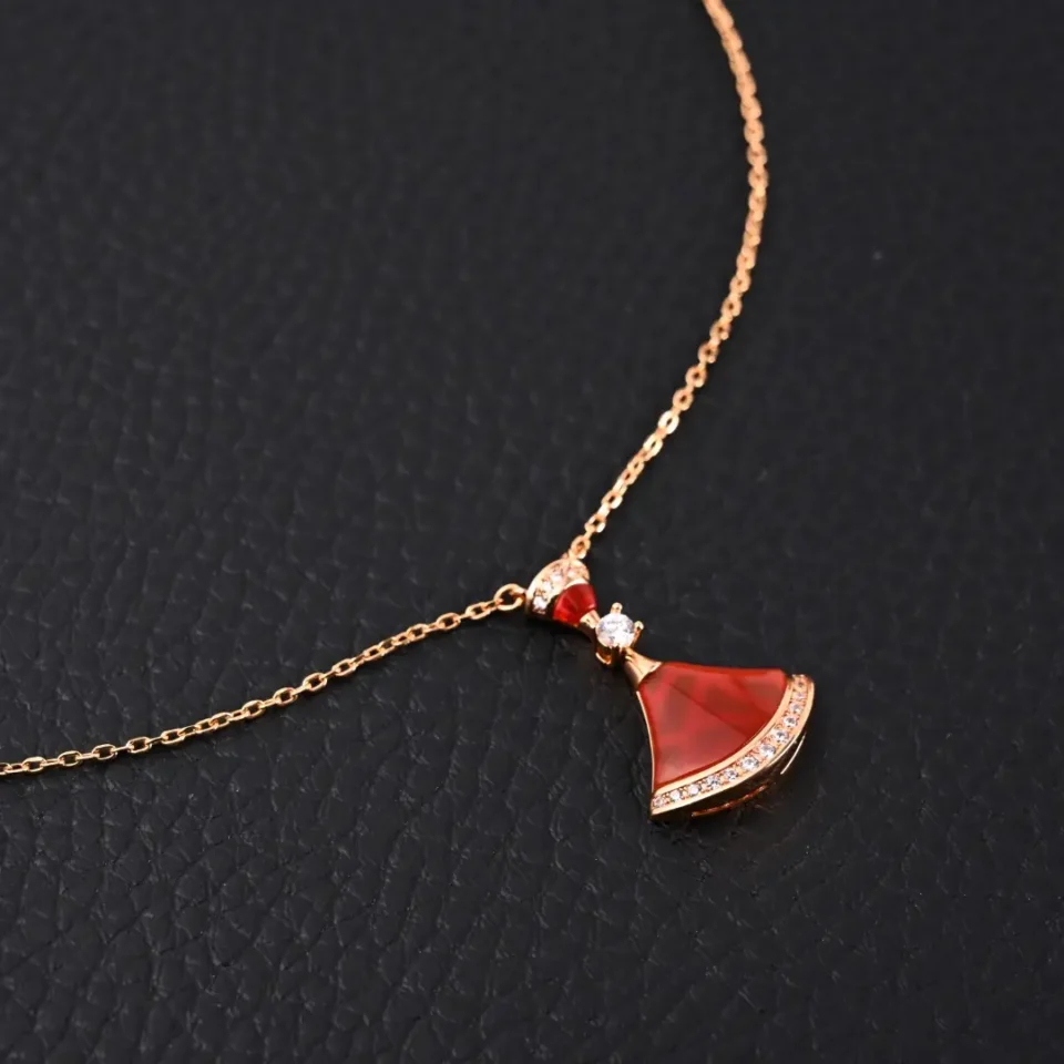 Unknown brand necklace red dress-shaped pendant gold-tone chain crystal accents