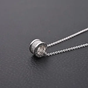 Bvlgari necklace silver tone pendant with pavé crystals and engraved logo detailing on chain