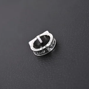 Chrome Hearts CH Cross Ring in vintage silver with intricate design and sparkling details, showcasing its unique features for potential purchase.